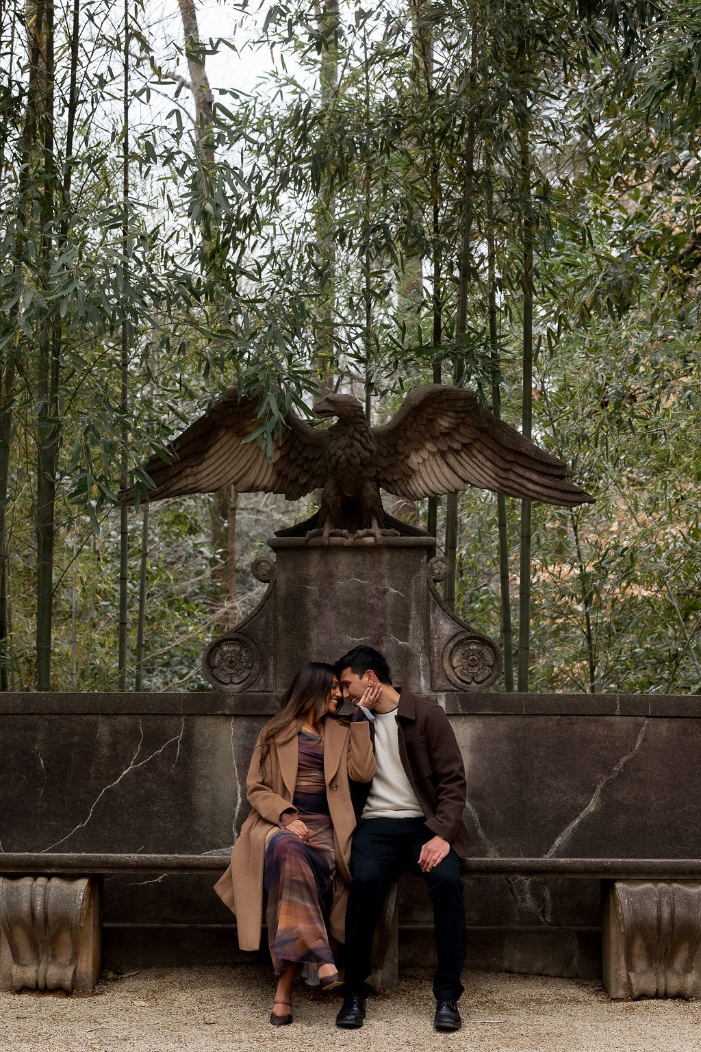 Man and woman sharing a kiss after accepting m,arriage proposal