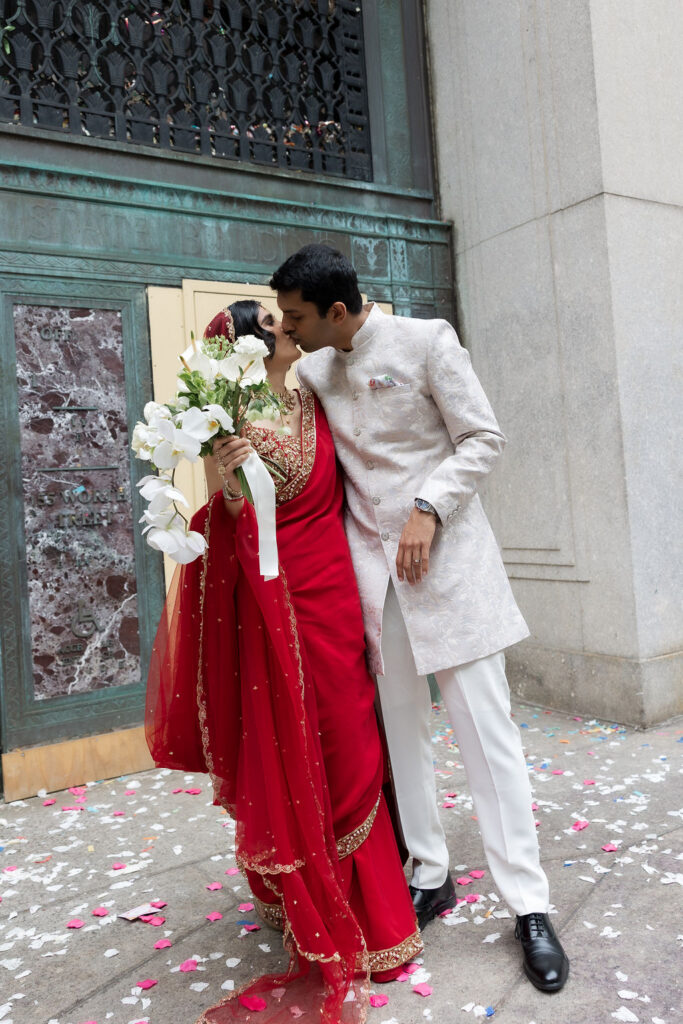 Newlyweds laughing together during a relaxed wedding day filled with meaningful moments and city views.
