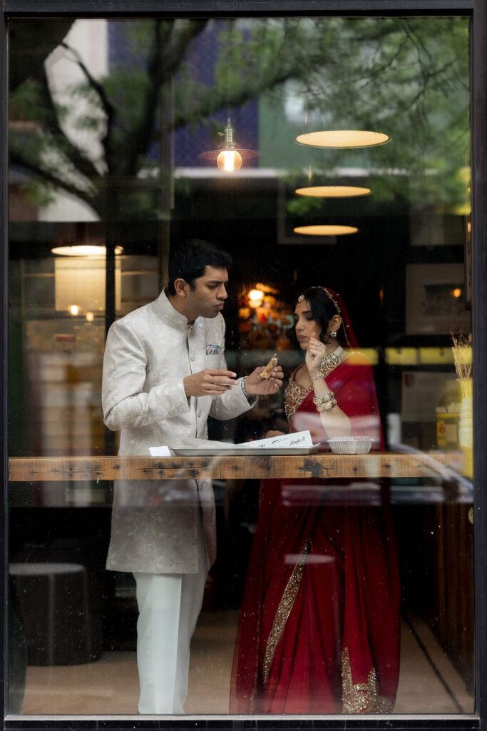 Couple sharing a quiet moment together while exploring the streets of New York City on their wedding day.

