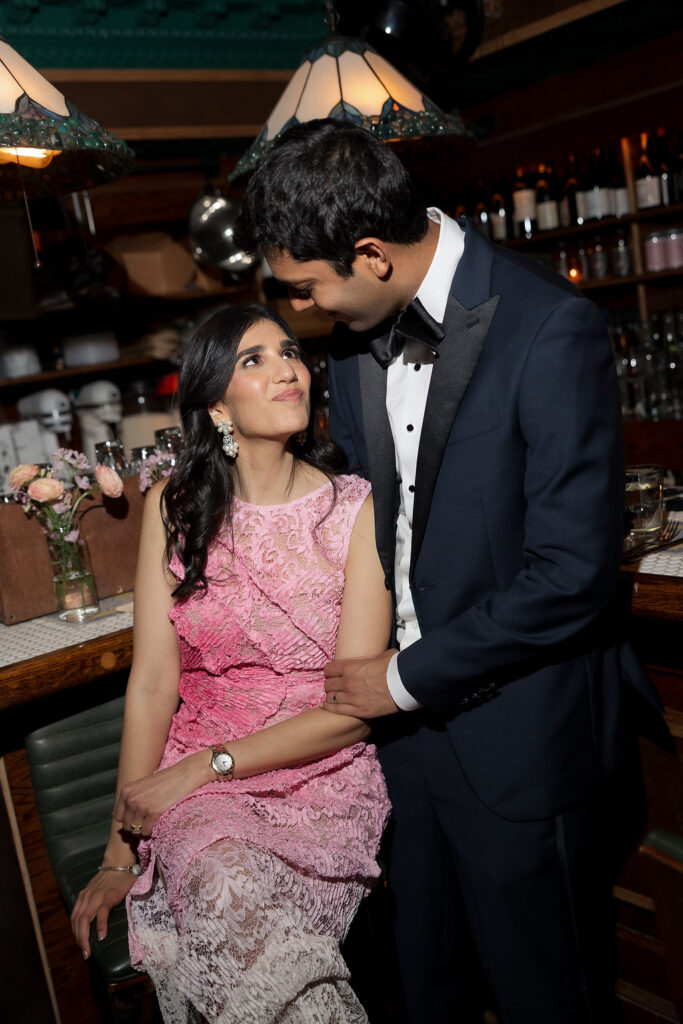 Guests celebrating with heartfelt speeches, delicious food, and dancing during an intimate New York City wedding reception.
